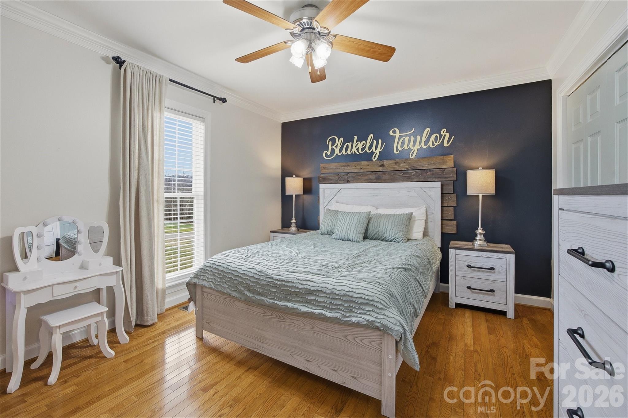 2553 Genes Loop Morganton, NC 28655 - Photo 27 of 32 a bedroom with a bed and a table