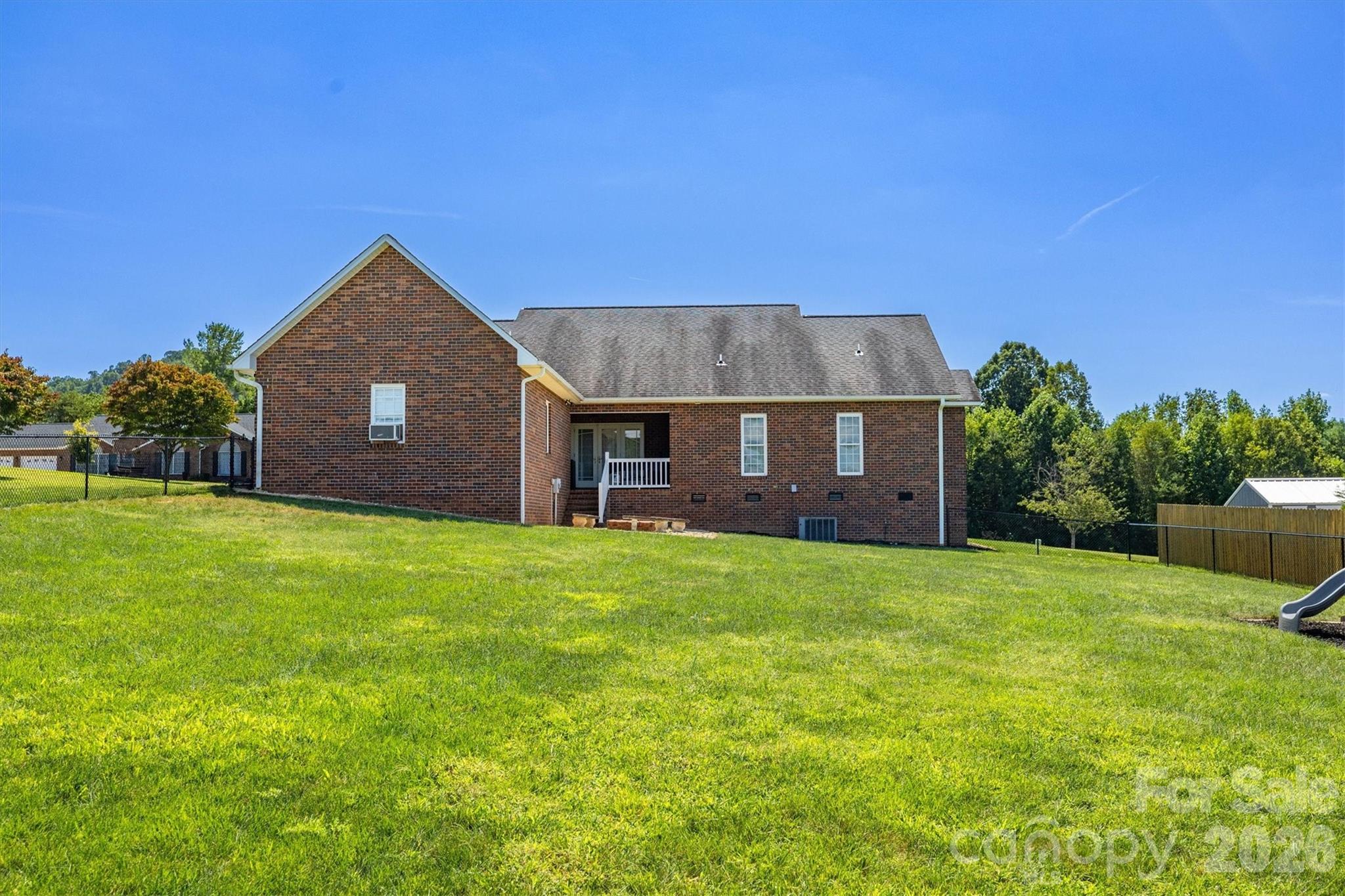 2553 Genes Loop Morganton, NC 28655 - Photo 30 of 32 a view of a house with a yard