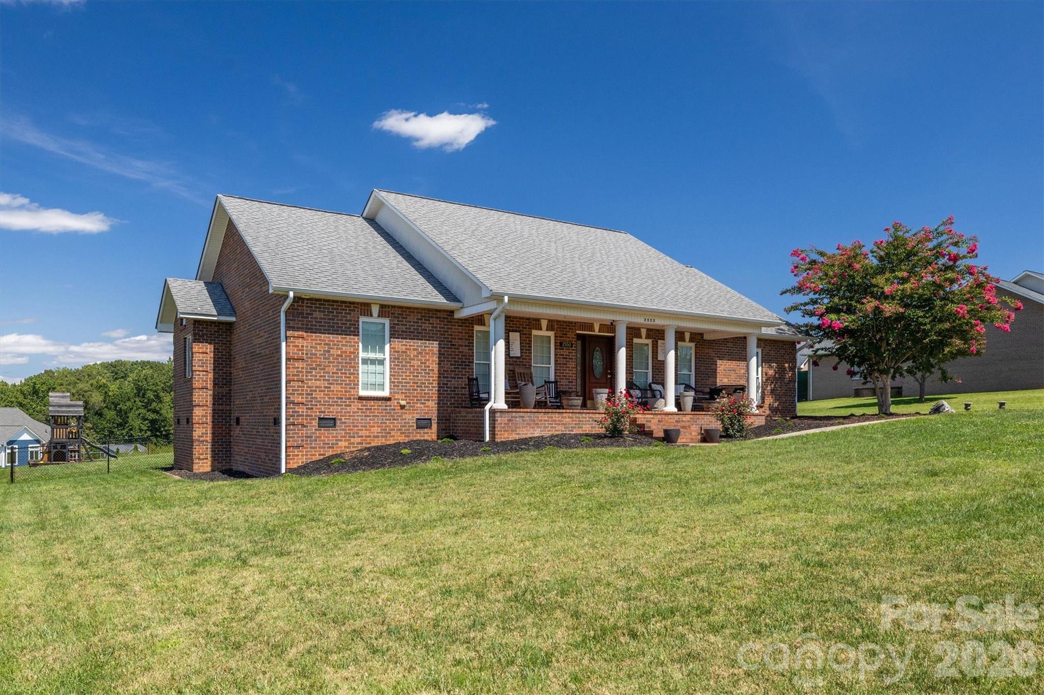 2553 Genes Loop Morganton, NC 28655 - Photo 4 of 32 a front view of a house with patio