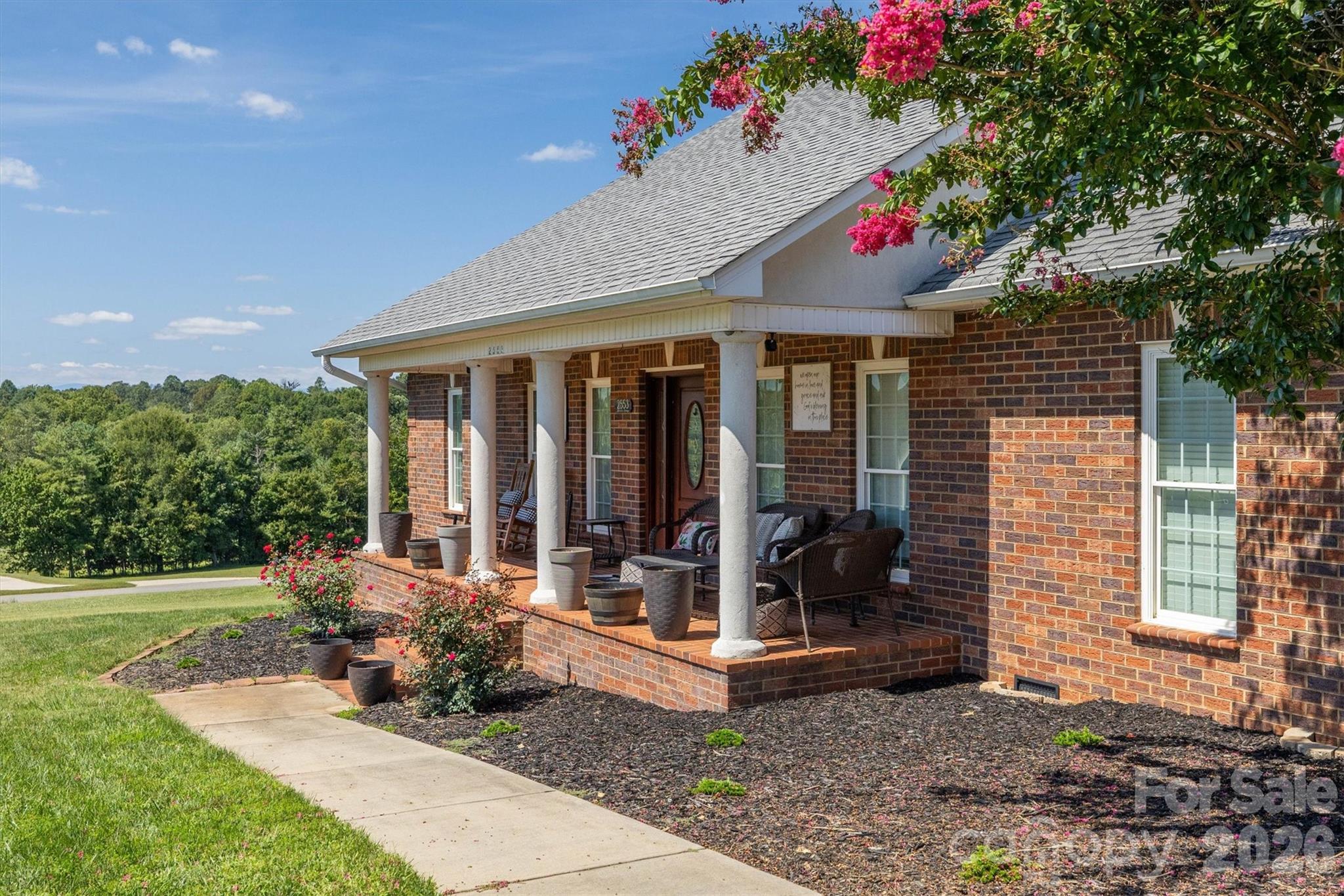 2553 Genes Loop Morganton, NC 28655 - Photo 5 of 32 a front view of a house with porch