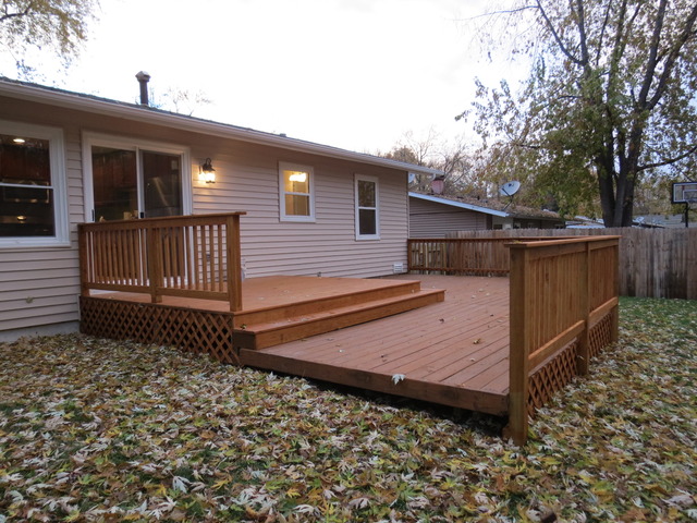 306 MacIntyre Street Lockport, IL 60441 - Photo 16 of 17 a view of a house with a wooden fence