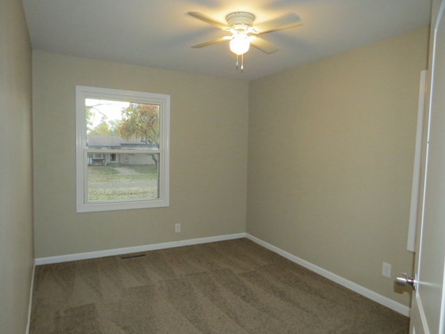 306 MacIntyre Street Lockport, IL 60441 - Photo 6 of 17 an empty room with a window