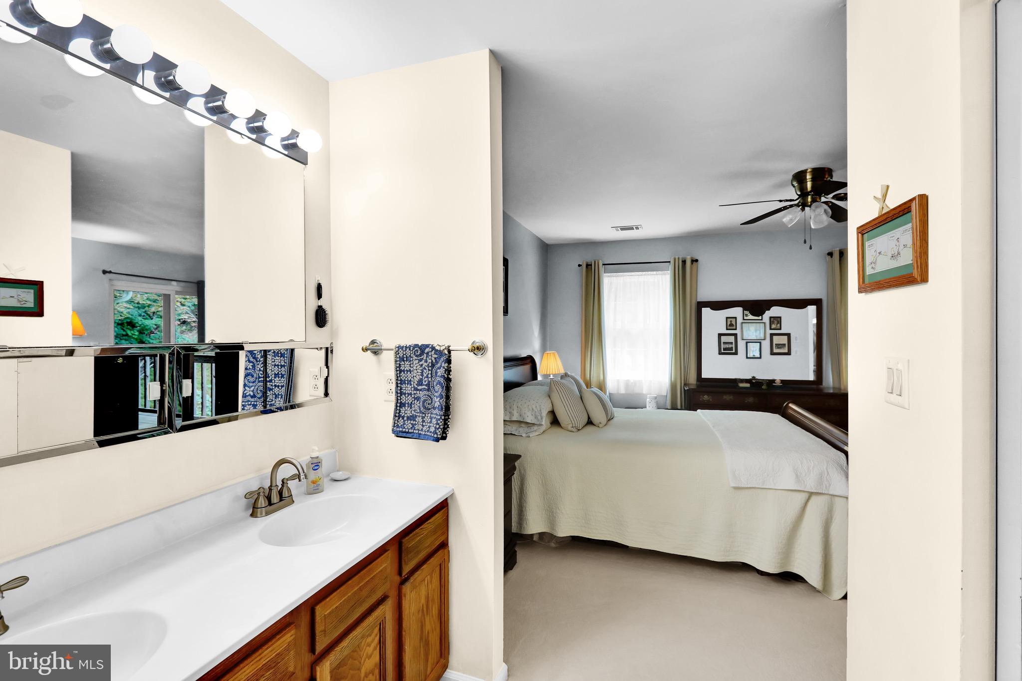 237 North 14th Street Reading, PA 19604 - Photo 17 of 26 a bedroom with a bed bathroom and mirror