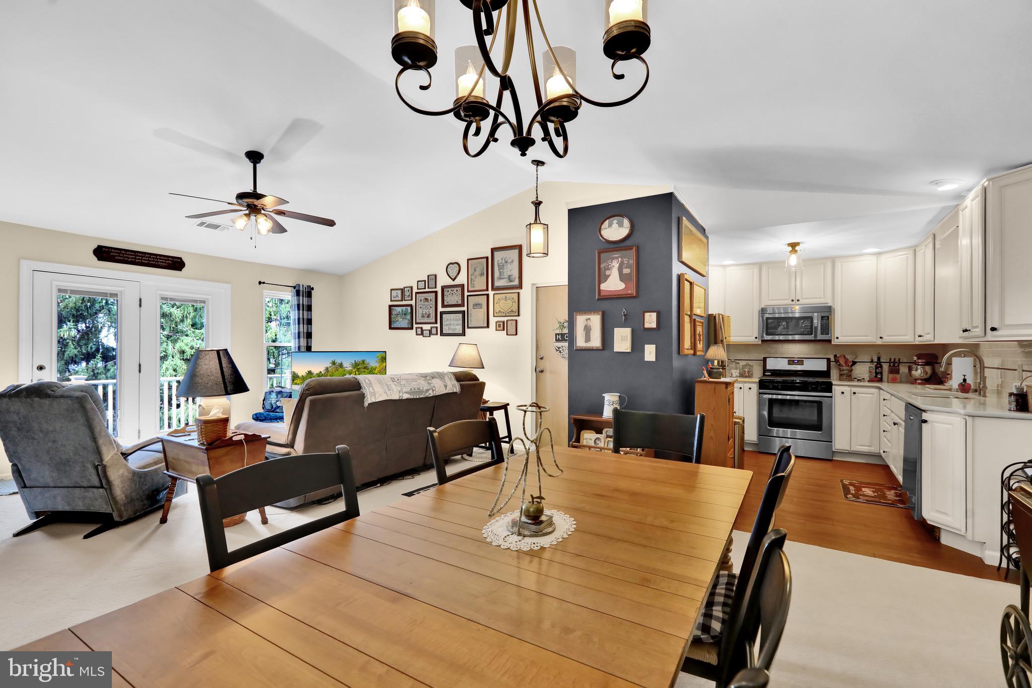 237 North 14th Street Reading, PA 19604 - Photo 7 of 26 a living room with furniture kitchen view and a chandelier