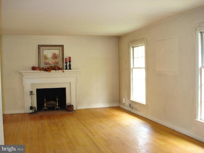 5017 Westport Road Chevy Chase, MD 20815 - Photo 2 of 13 Cozy fireplace and hardwood floors