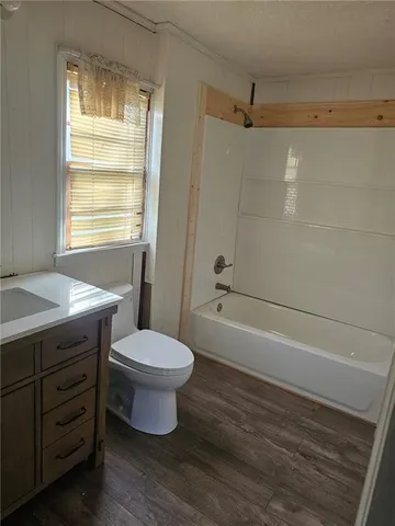 an empty room with a empty space and windows