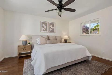 a bedroom with bed and a window