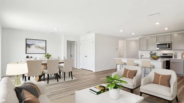 a living room with furniture and a dining table with wooden floor