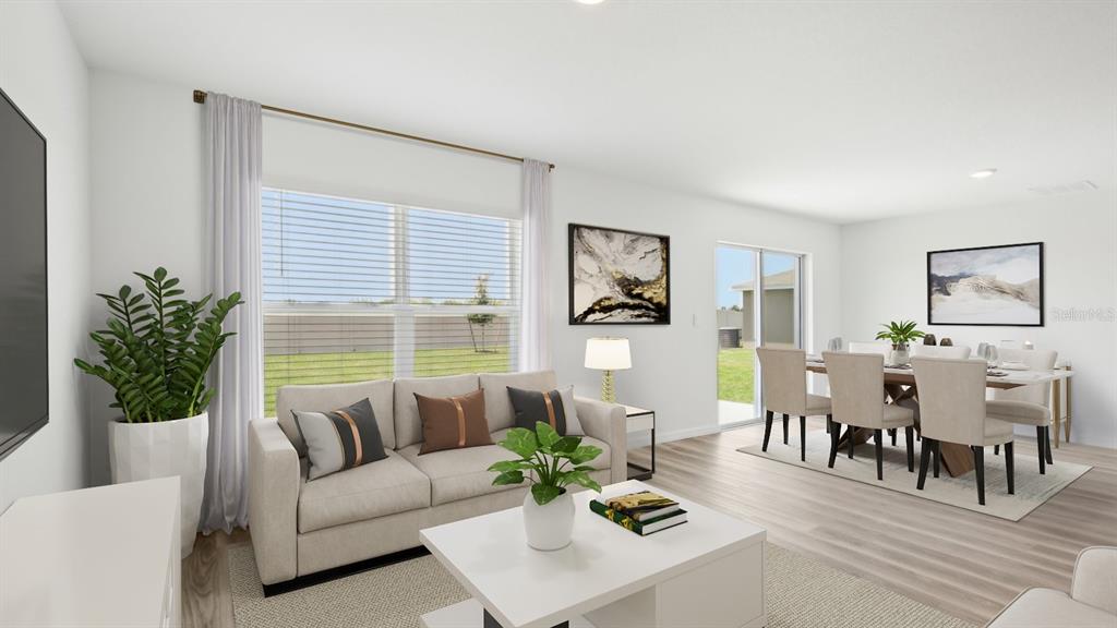35305 Vly Rdg Road Dade City, FL 33525 - Photo 8 of 14 a living room with furniture potted plant and window