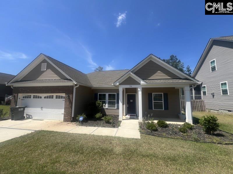 516 Mitscher Way Chapin, SC 29036 - Photo 1 of 18 a front view of a house with a yard and garage