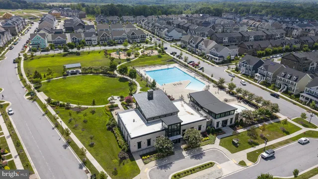 an aerial view of a house with a swimming pool