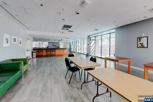 a backyard of a house with barbeque oven and furniture