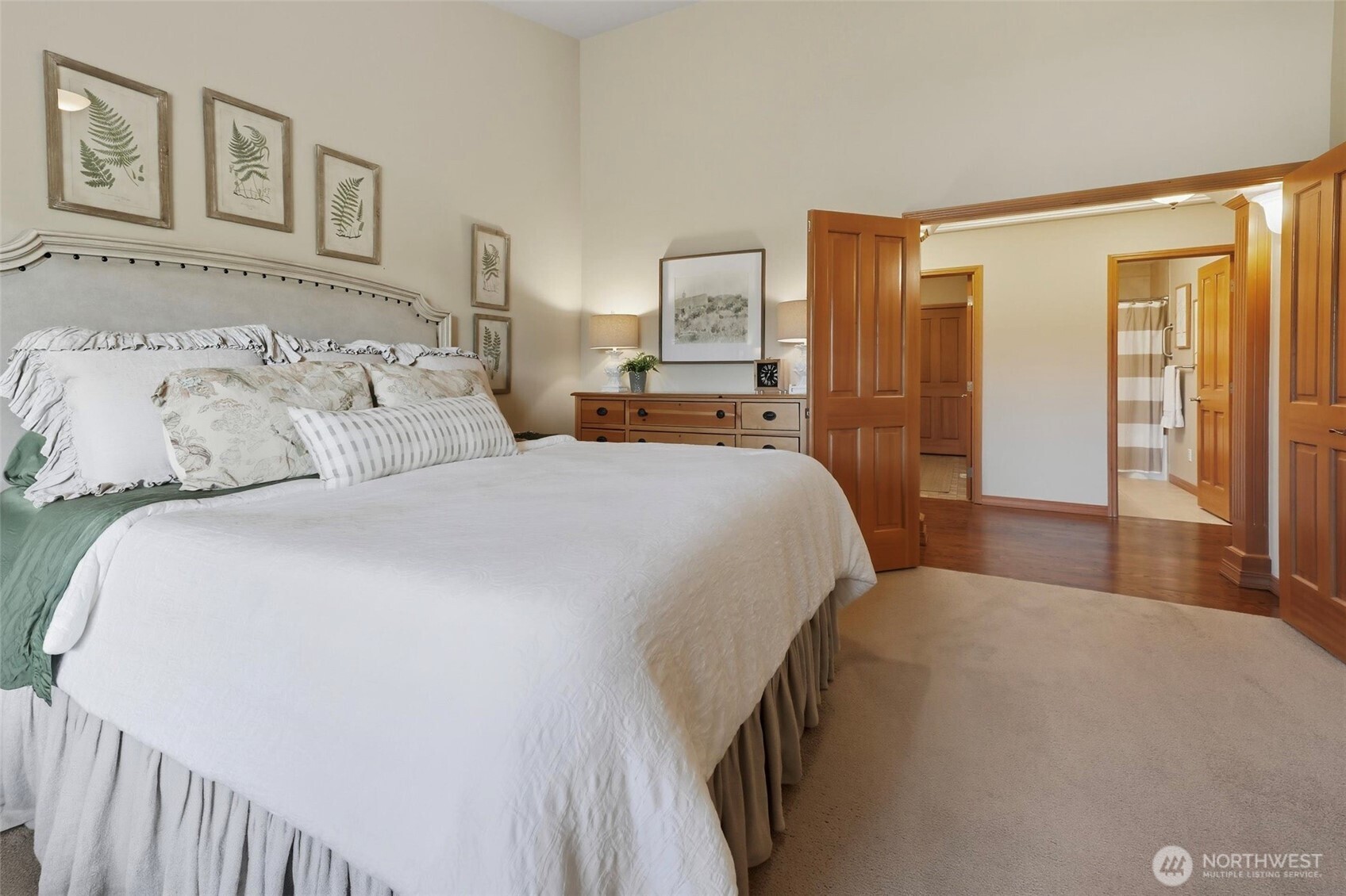 20615 39th Avenue Southeast Bothell, WA 98021 - Photo 16 of 37 a bedroom with a large bed and a chandelier