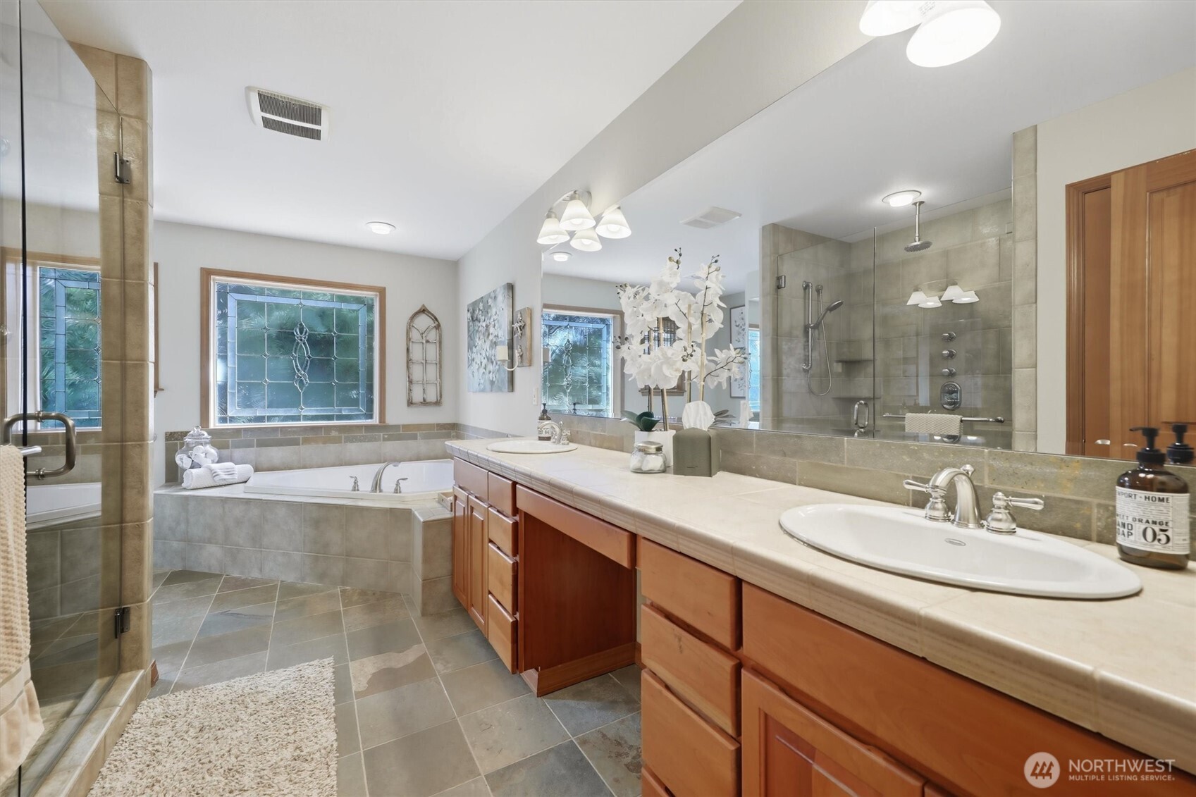 20615 39th Avenue Southeast Bothell, WA 98021 - Photo 17 of 37 a bathroom with a granite countertop sink mirror and bathtub