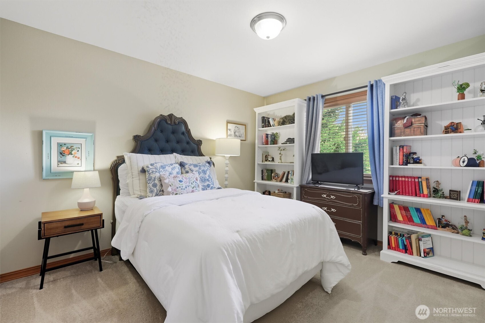 20615 39th Avenue Southeast Bothell, WA 98021 - Photo 23 of 37 a bedroom with a bed a dresser and a book shelf