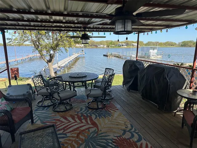 a view of a chairs and table in the patio