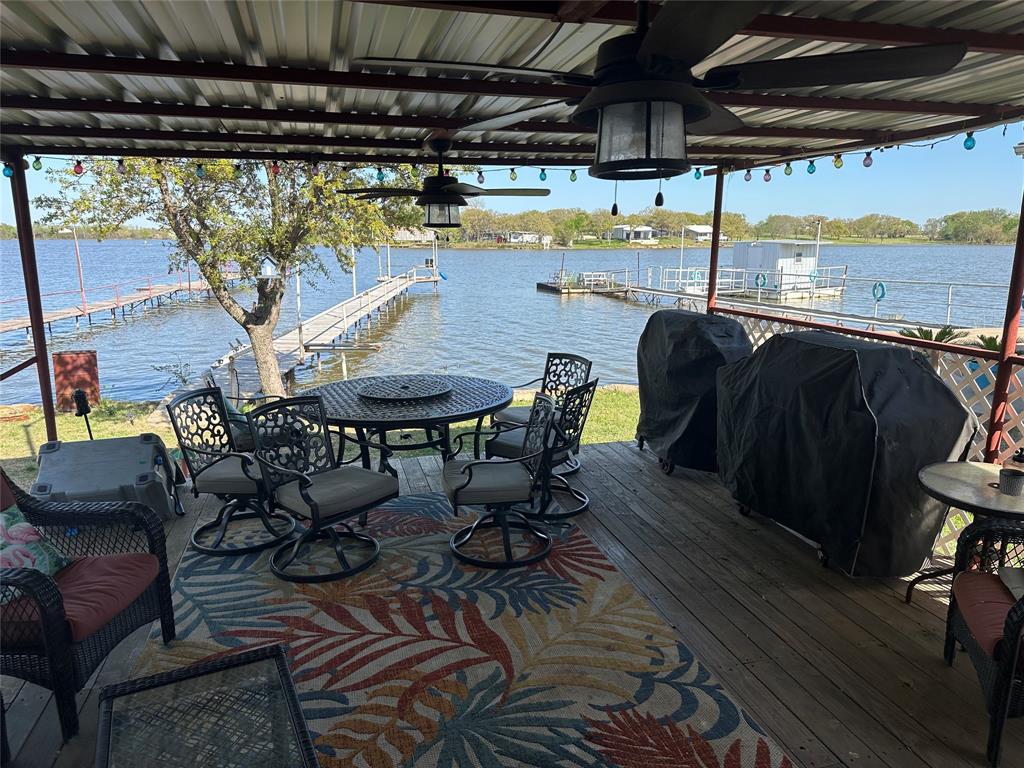 a view of a chairs and table in the patio