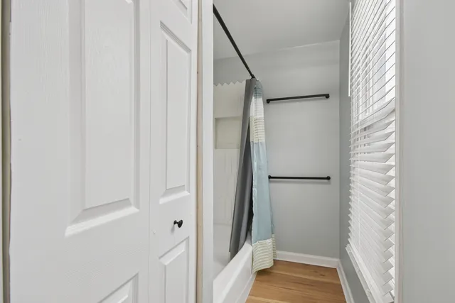 a view of a kitchen from a hallway
