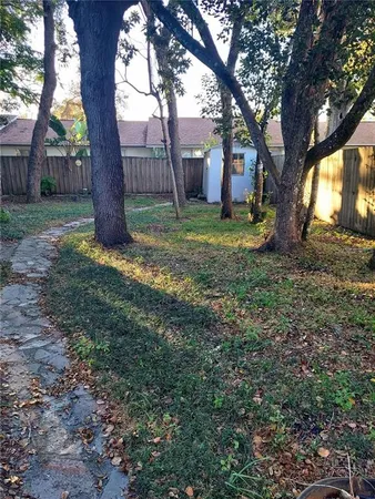 a backyard of a house with lots of green space