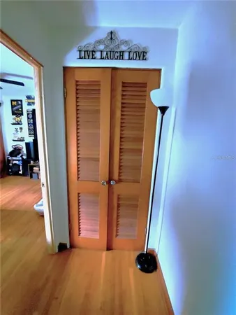 a view of front door with wooden floor