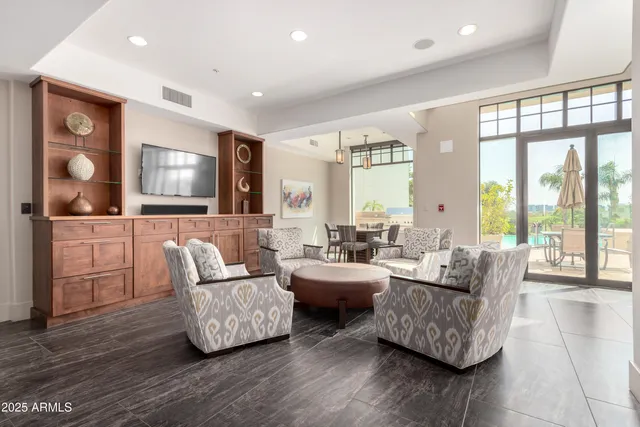 a living room with furniture and flat screen tv