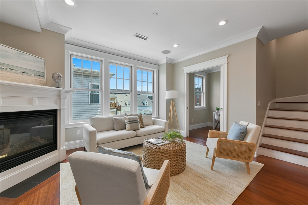 111 Bolton Street, Unit 2 Boston, MA 02127 - Photo 11 of 36 a living room with furniture and a fireplace