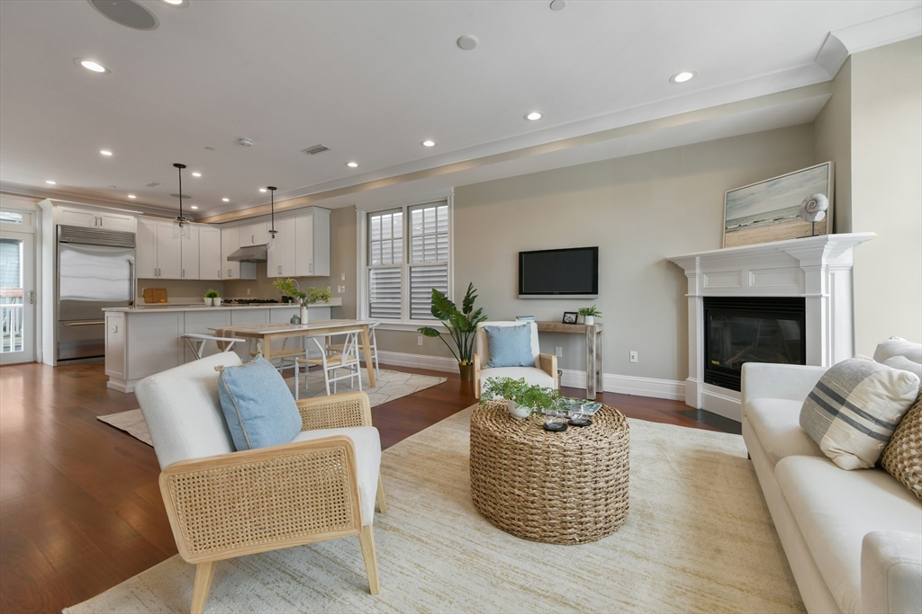 111 Bolton Street, Unit 2 Boston, MA 02127 - Photo 13 of 36 a living room with furniture and a fireplace