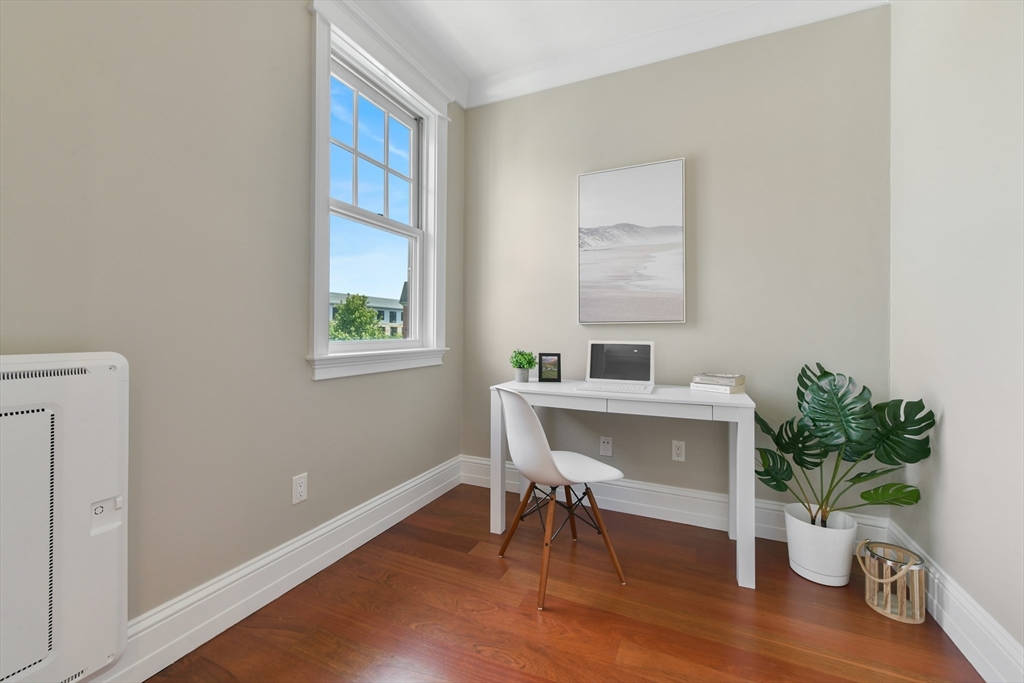 111 Bolton Street, Unit 2 Boston, MA 02127 - Photo 14 of 36 a workspace with furniture and a potted plant