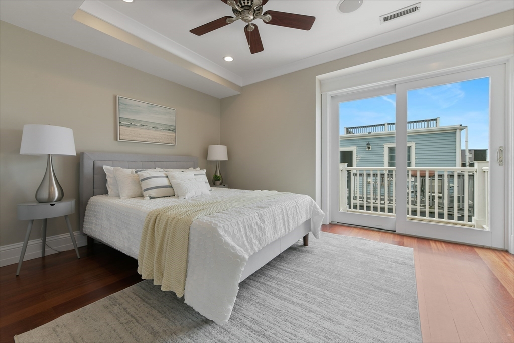 111 Bolton Street, Unit 2 Boston, MA 02127 - Photo 18 of 36 a bedroom with a bed and a large window