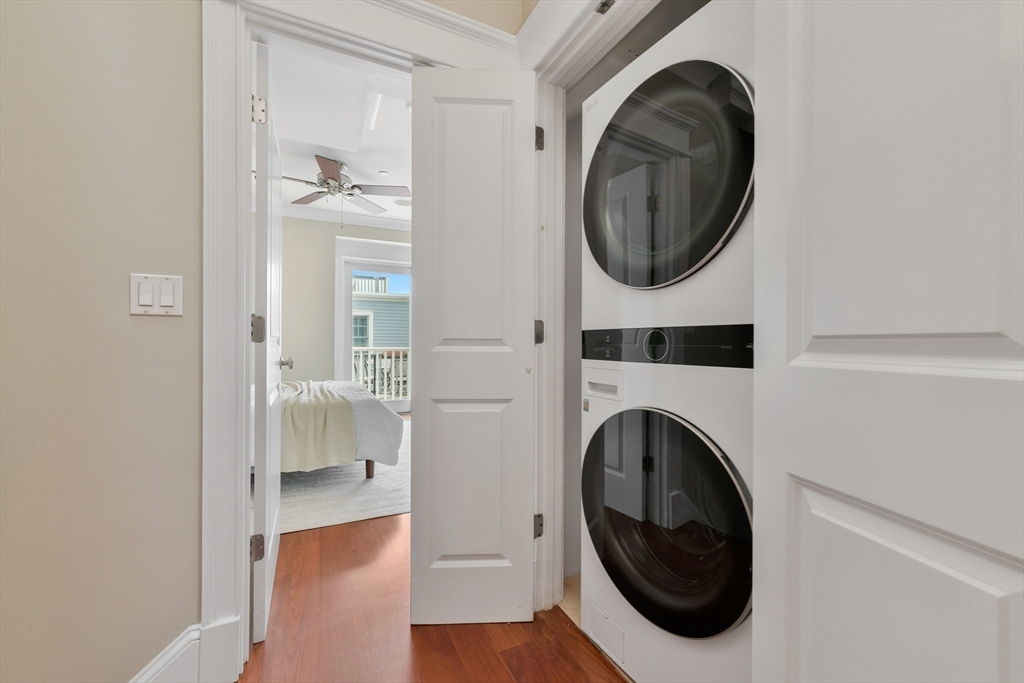 111 Bolton Street, Unit 2 Boston, MA 02127 - Photo 22 of 36 a view of a hallway with washer and dryer