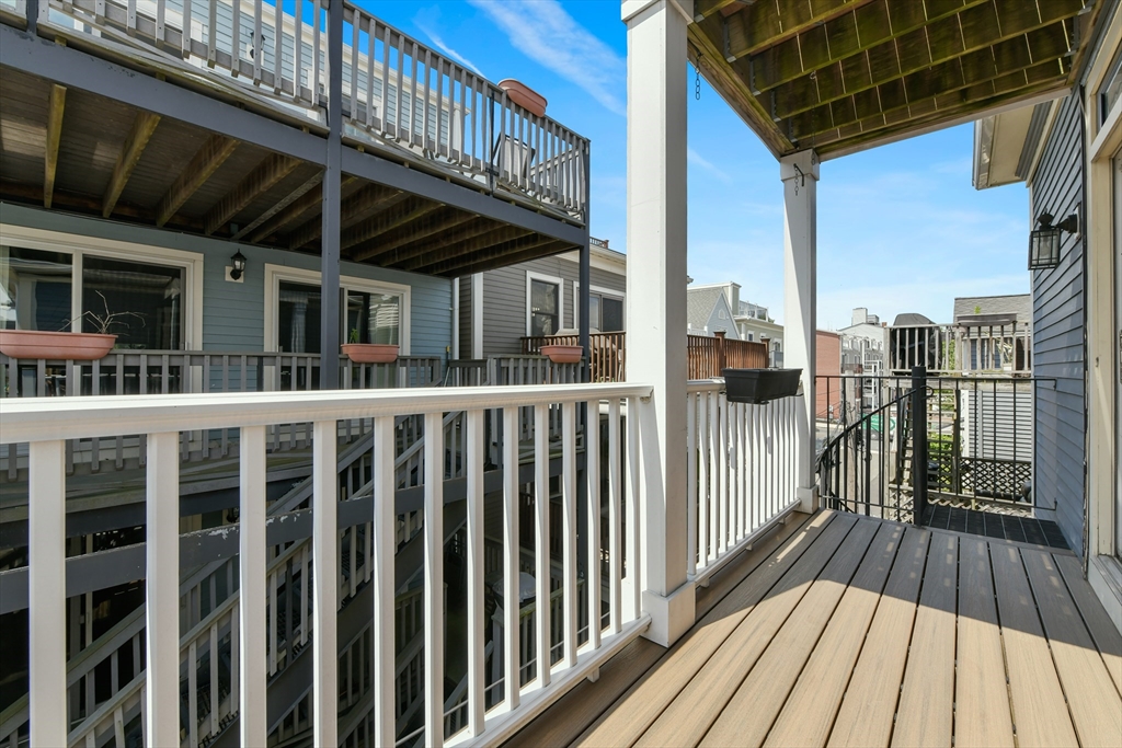 111 Bolton Street, Unit 2 Boston, MA 02127 - Photo 32 of 36 a view of a balcony with wooden floor and wooden floor