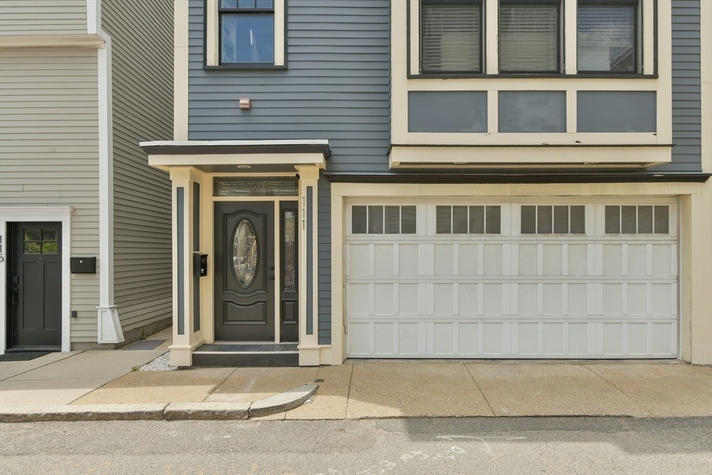 111 Bolton Street, Unit 2 Boston, MA 02127 - Photo 34 of 36 a view of a brick house with large windows