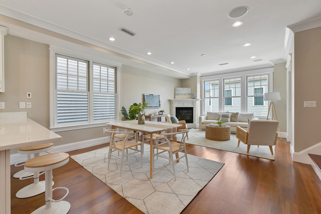 111 Bolton Street, Unit 2 Boston, MA 02127 - Photo 6 of 36 a view of a dining room with furniture window and wooden floor