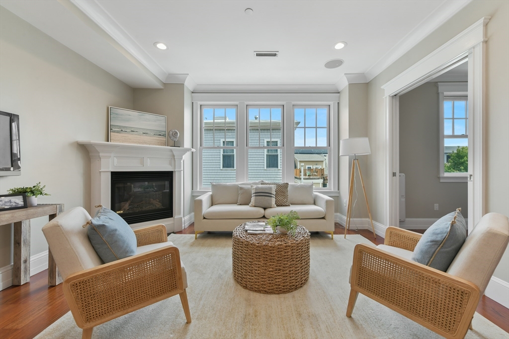 111 Bolton Street, Unit 2 Boston, MA 02127 - Photo 10 of 36 a living room with furniture and a fireplace