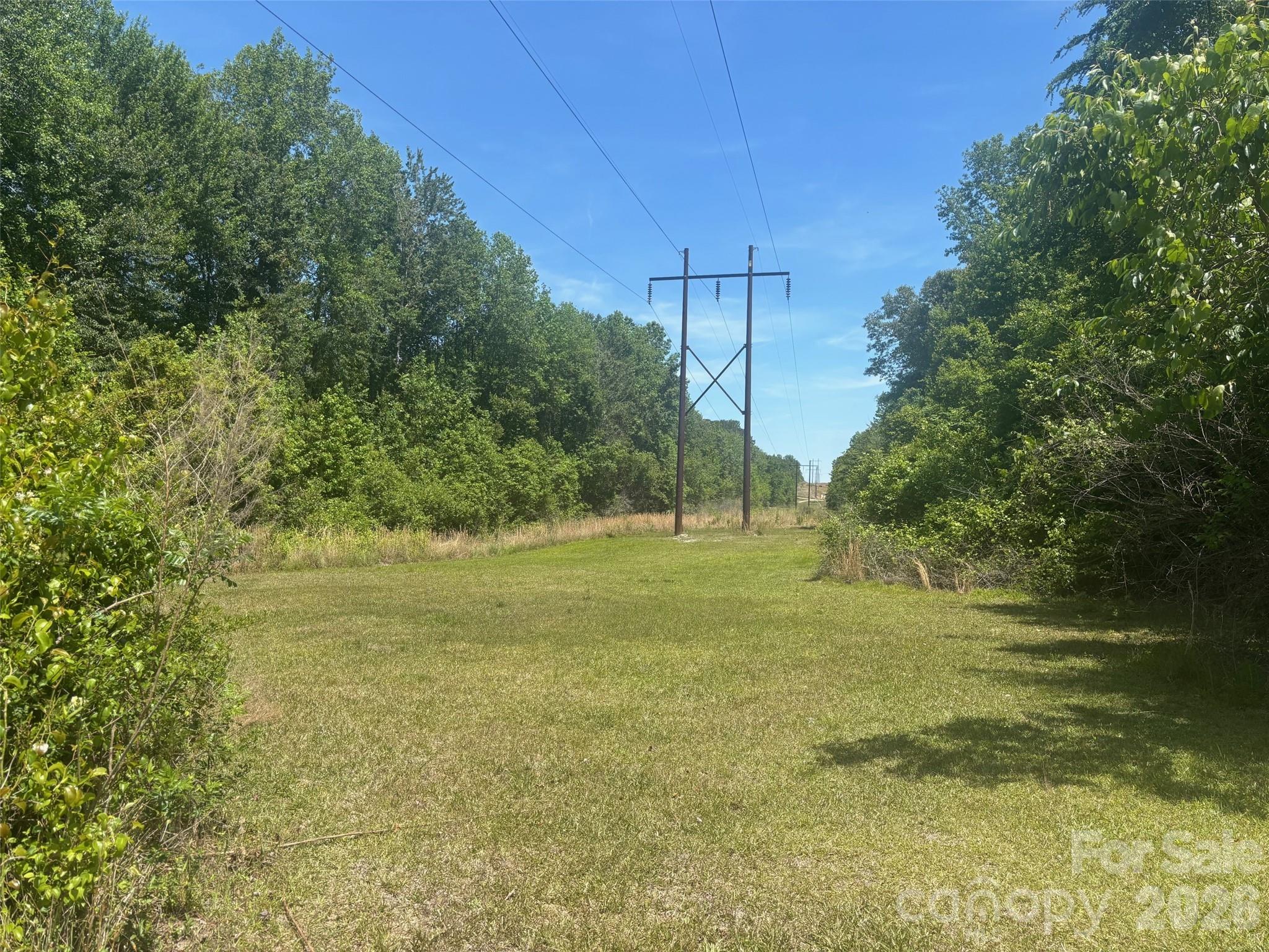 2206 Highway 1 Elgin, SC 29045 - Photo 1 of 5 a view of a field with an trees