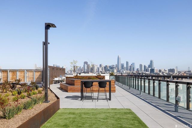 a view of a roof deck with couches