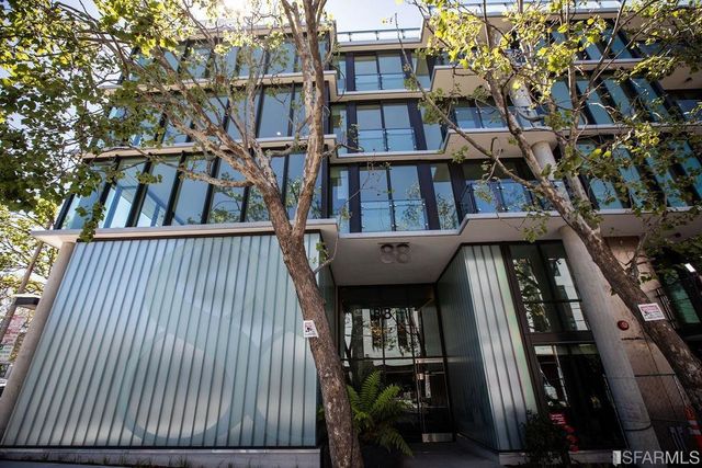 a view of staircase going to roof with metal railing and plants