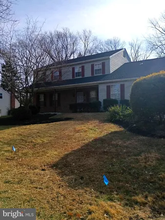 a view of a house with a yard and plants