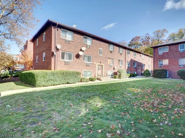 a front view of building with yard