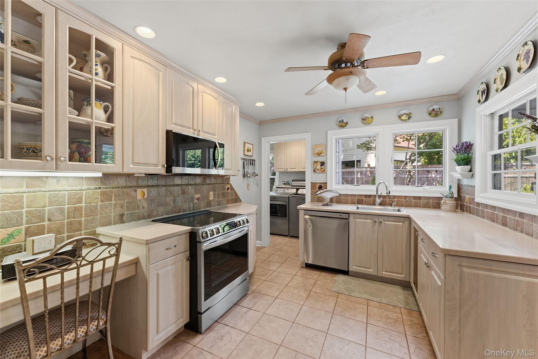 30 Birchbrook Road Bronxville, NY 10708 - Photo 11 of 34 View of the Kitchen featuring 3 windows and recessed lighting.
