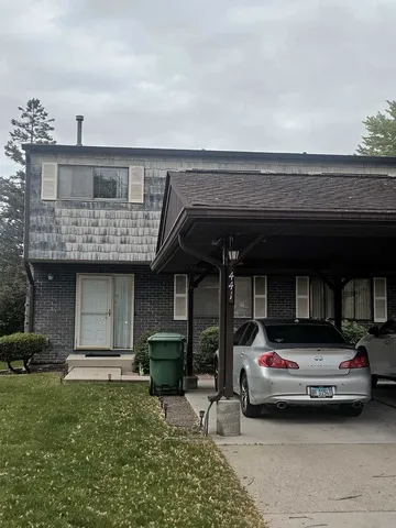 a view of car parked in front of house