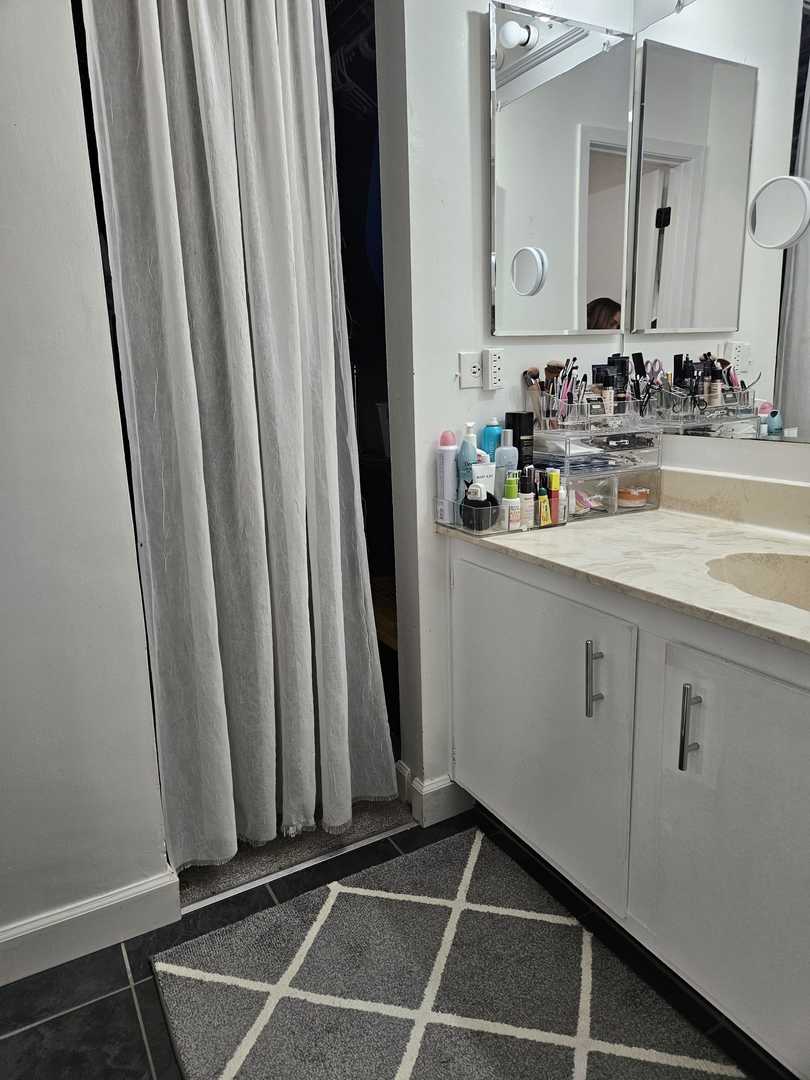 441 Commanche Trail Wheeling, IL 60090 - Photo 19 of 26 a view of a sink and a mirror