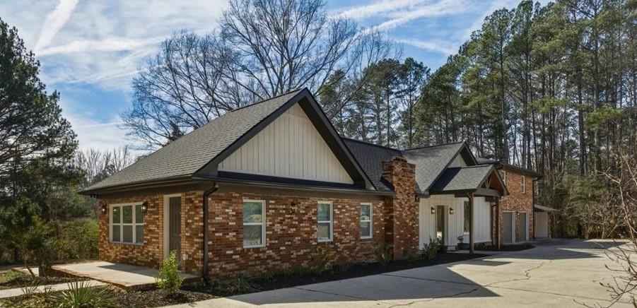 4911 Lower Jersey Road Oxford, GA 30054 - Photo 40 of 56 a front view of a house with garden