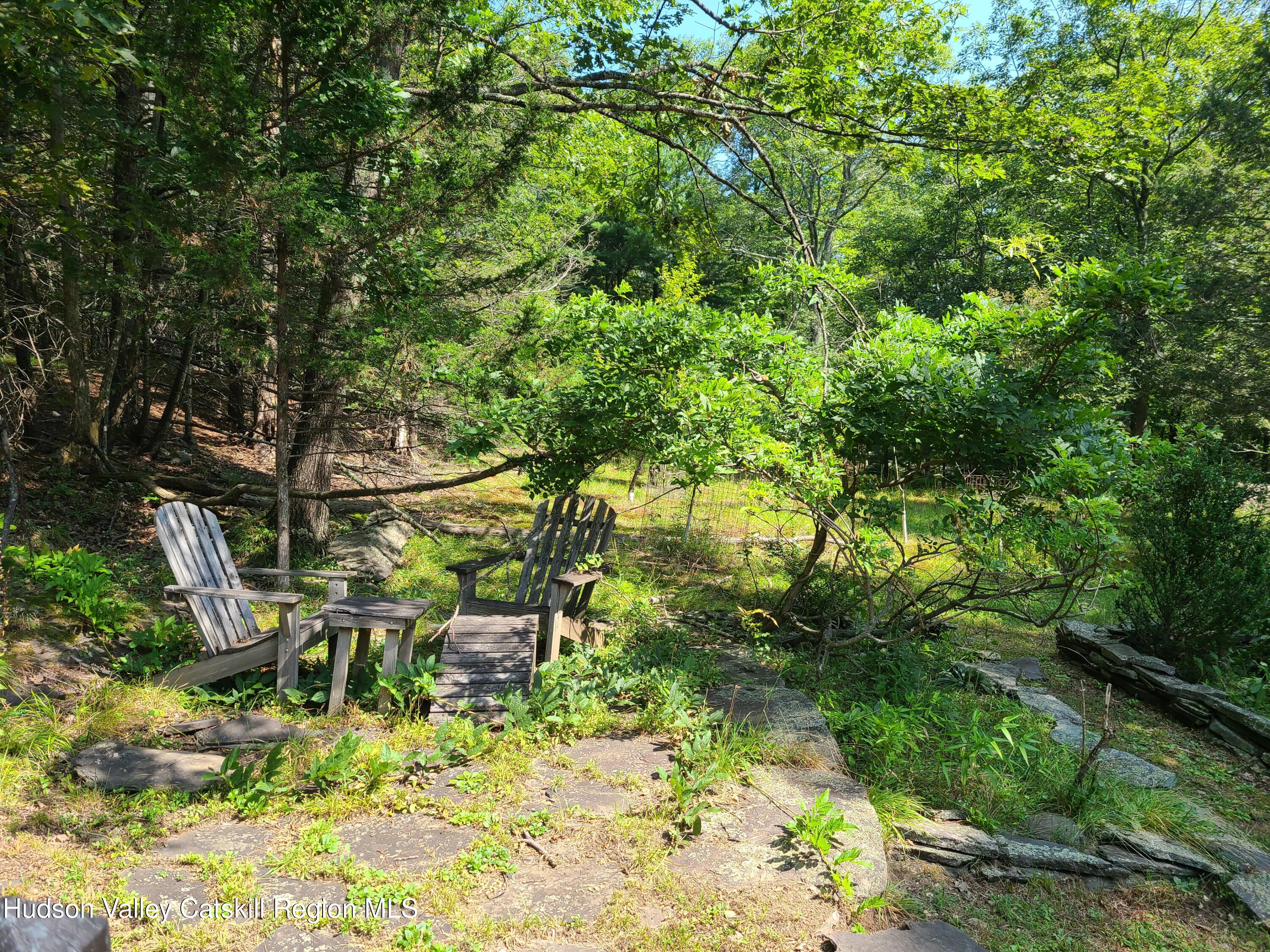 44 Sheldon Hill Road Olivebridge, NY 12461 - Photo 14 of 24 a backyard of a house with yard and outdoor seating