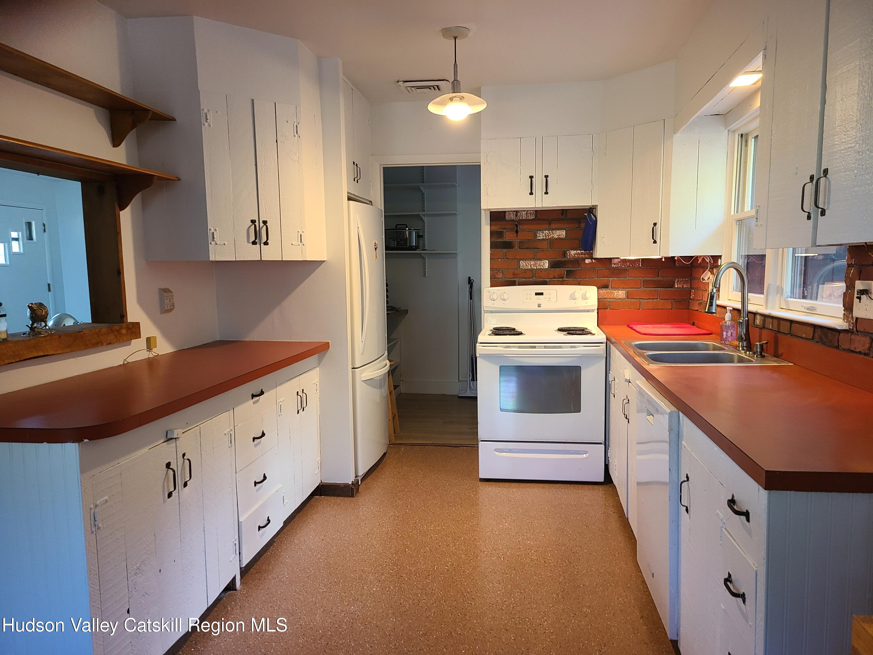 44 Sheldon Hill Road Olivebridge, NY 12461 - Photo 18 of 24 a kitchen with granite countertop a sink stove and refrigerator
