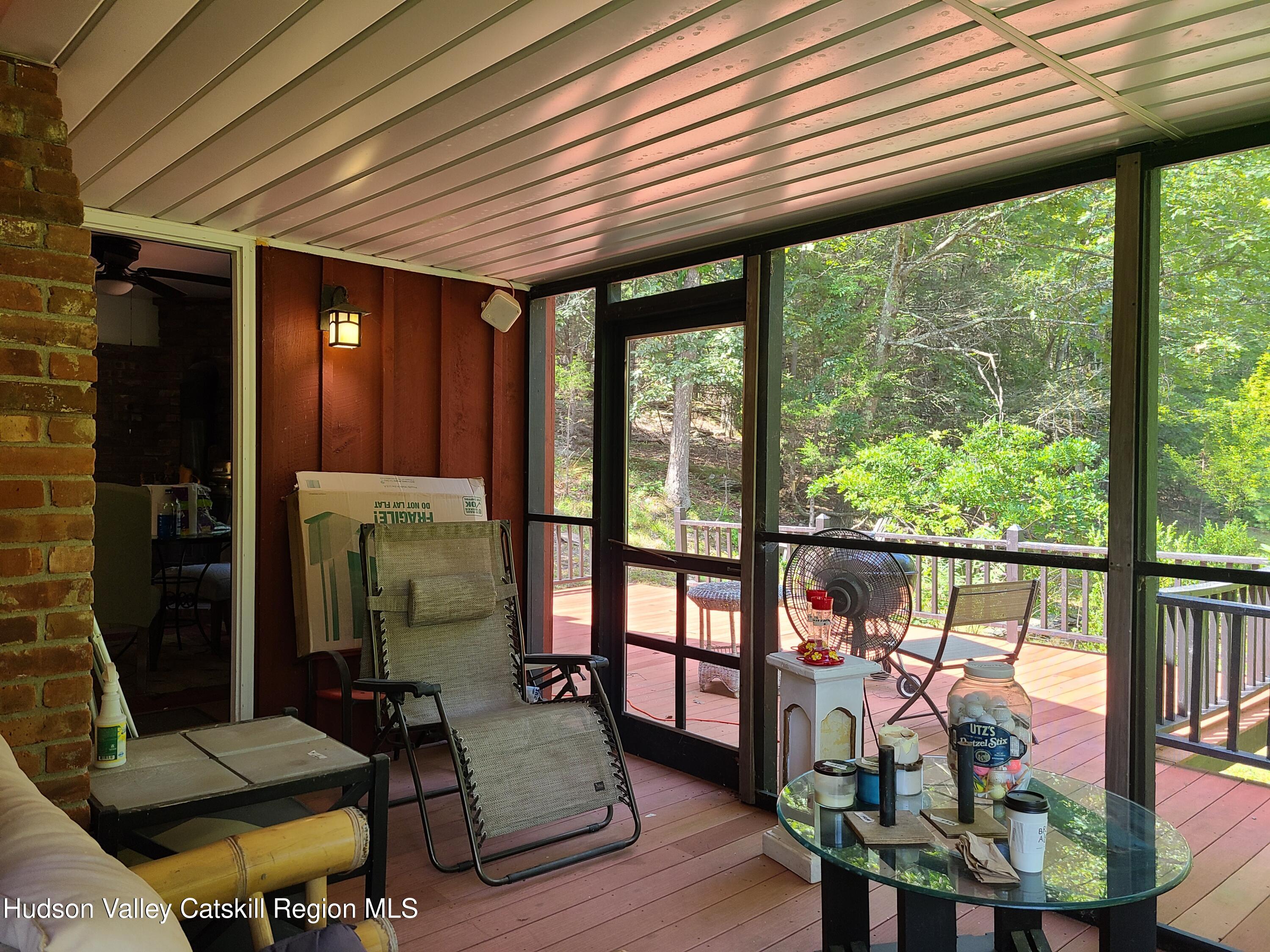 44 Sheldon Hill Road Olivebridge, NY 12461 - Photo 7 of 24 a living room with furniture and a floor to ceiling window