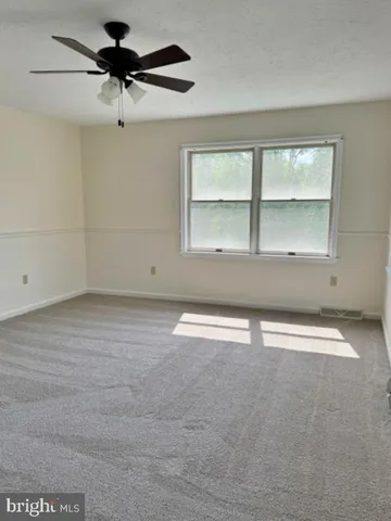 an empty room with a empty space and a window