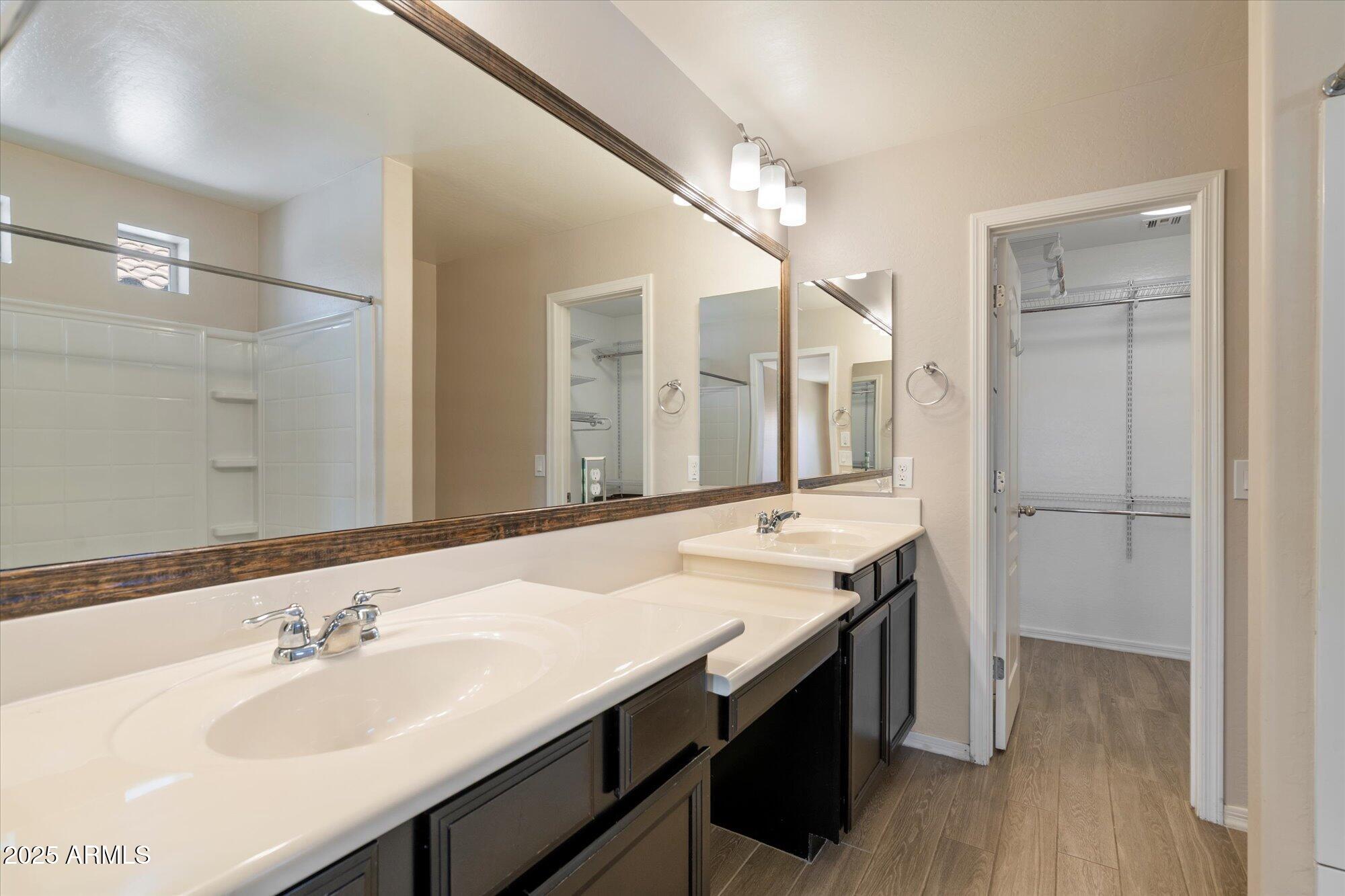 737 East Harwell Road Phoenix, AZ 85042 - Photo 18 of 28 a bathroom with a sink and a mirror