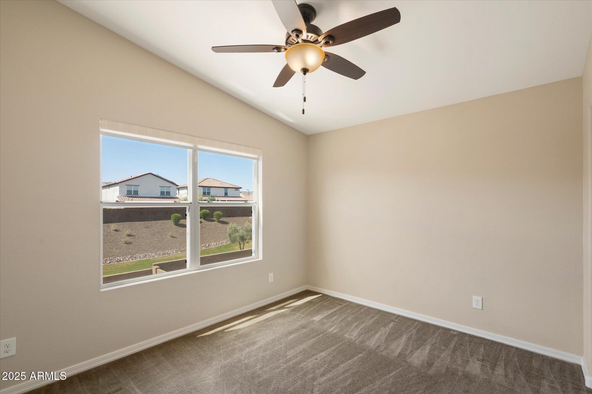 737 East Harwell Road Phoenix, AZ 85042 - Photo 19 of 28 an empty room with windows and fan
