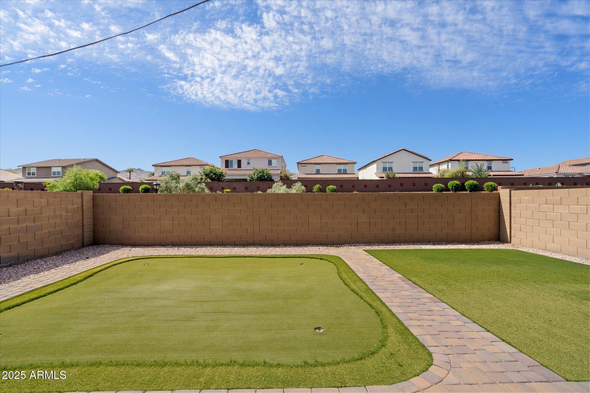 737 East Harwell Road Phoenix, AZ 85042 - Photo 26 of 28 a view of a swimming pool with a yard and mountain view